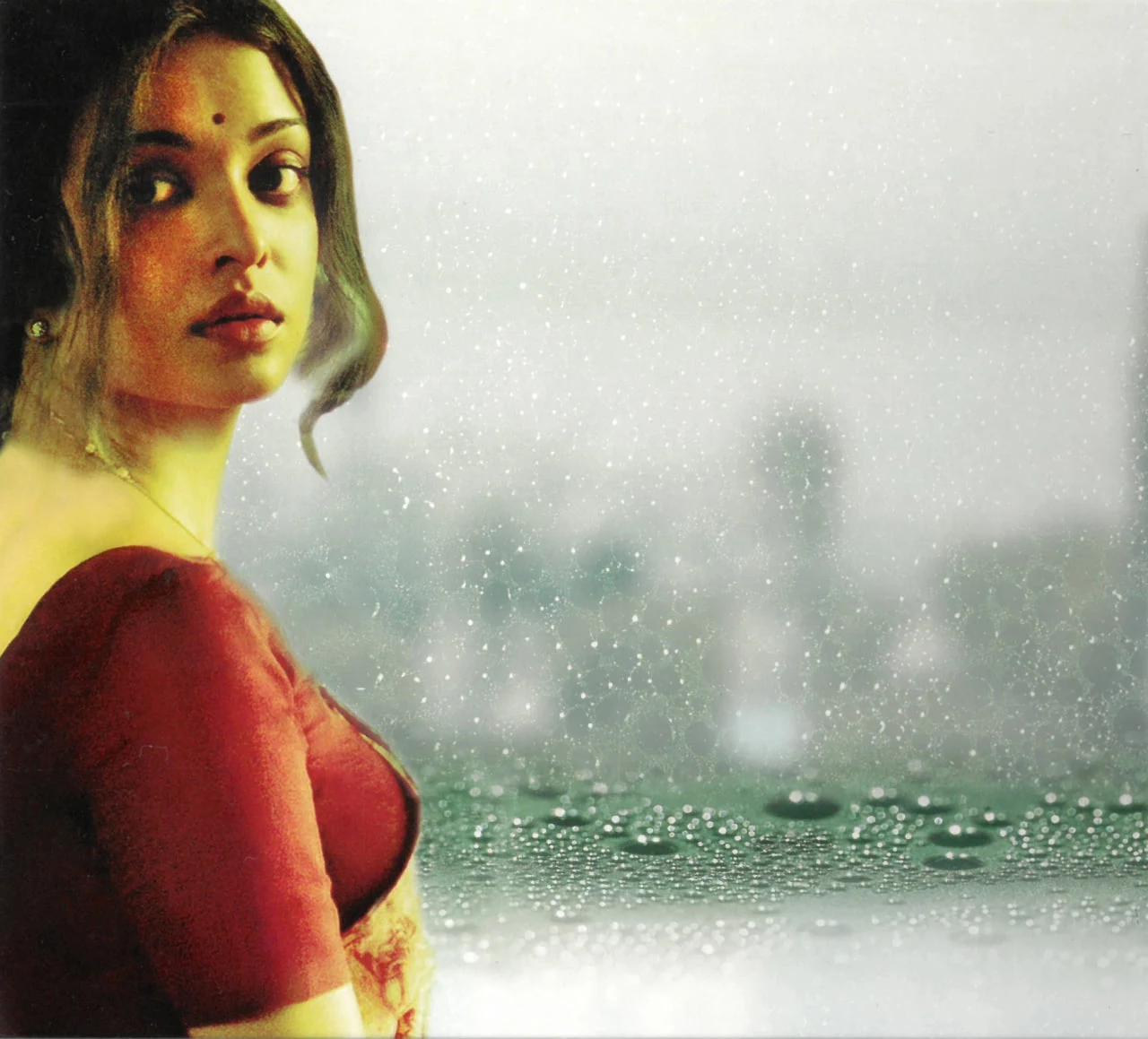 Aishwarya Rai at a rain-streaked window